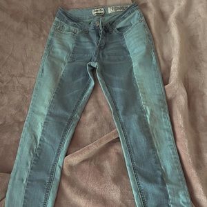 2 toned blue jeans with ankle distressing